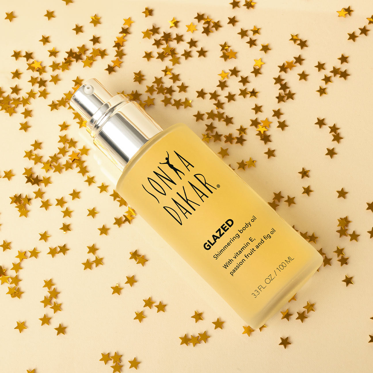 Glazed shimmering body oil with a blend of vitamin E, passion fruit, and fig oil