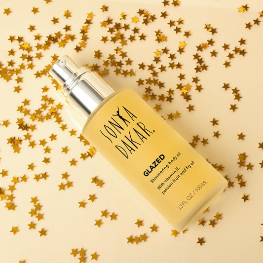 Glazed shimmering body oil with a blend of vitamin E, passion fruit, and fig oil